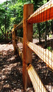 cedar split rail fence with wire fence attached