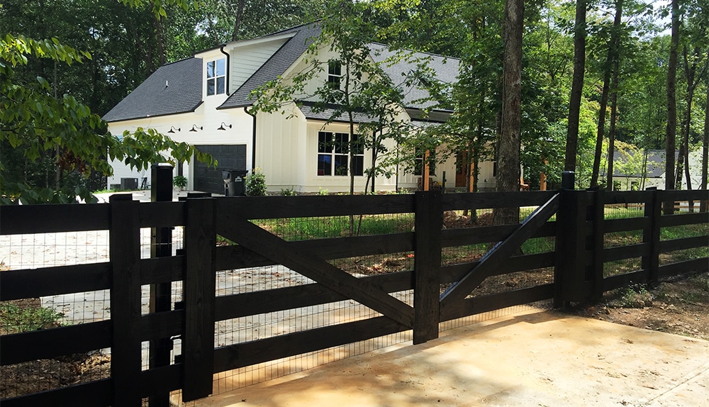 black 4 board horizontal fence and drive gate